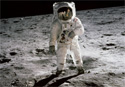 Neil Armstrong and Buzz Aldrin walk on the Moon.